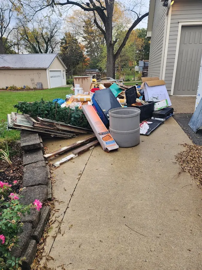 Dumpster being loaded with debris for 30 Yard Dumpster Rental in El Reno